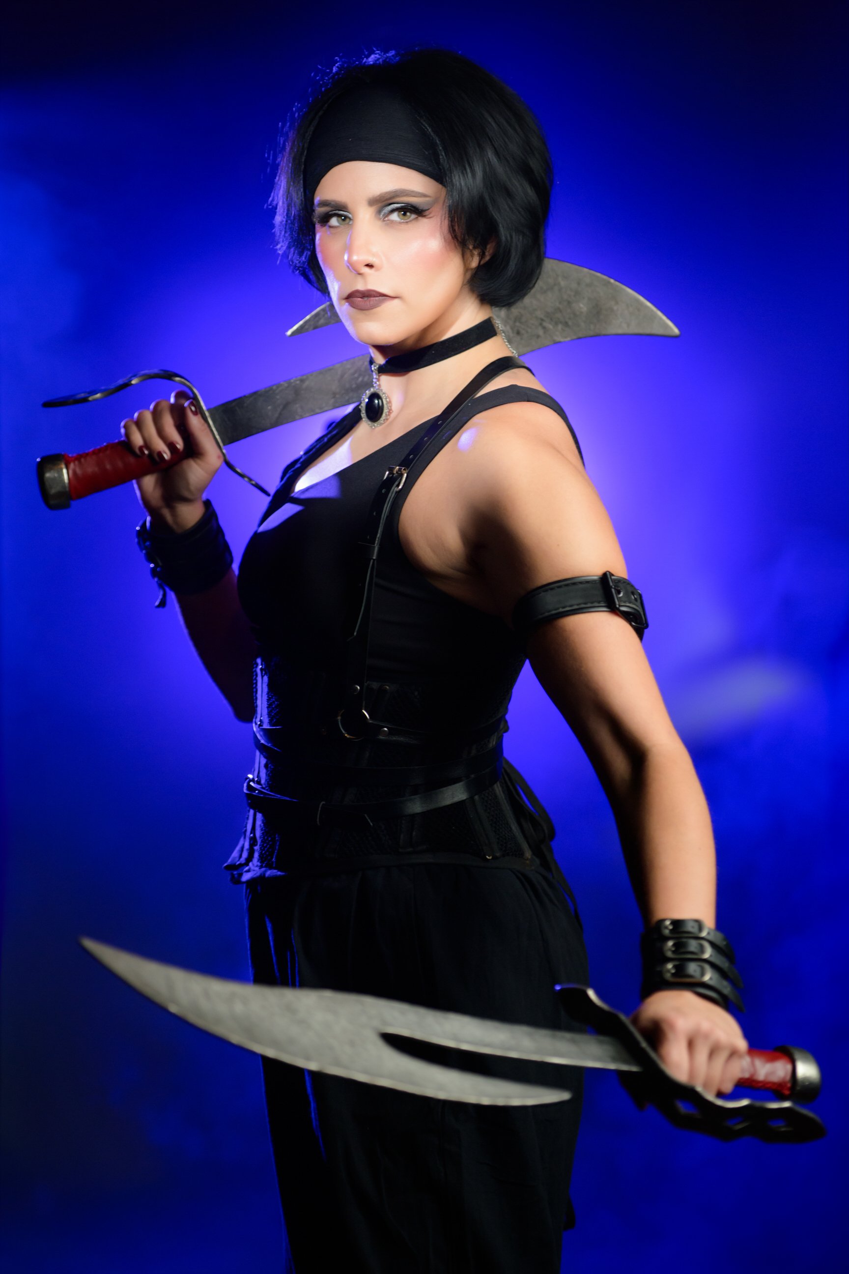 Kate, the Monster Hunter holding a weapon