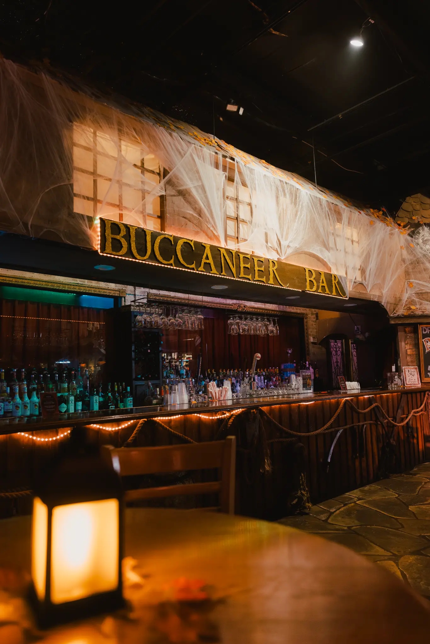 The Buccaneer Bar themed for Vampirates with Halloween cobwebs and lantern light