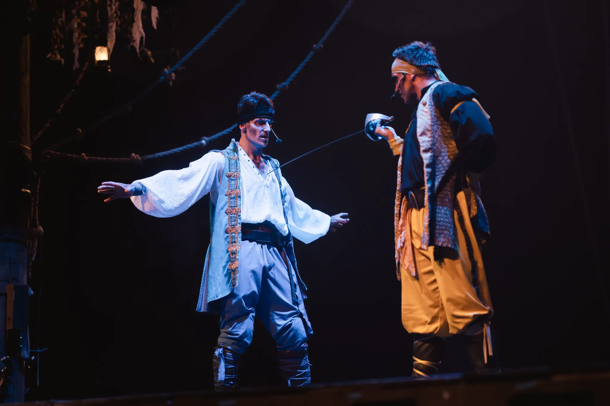 Antonio holds Benjamin at swordpoint during a live Vampirates performance