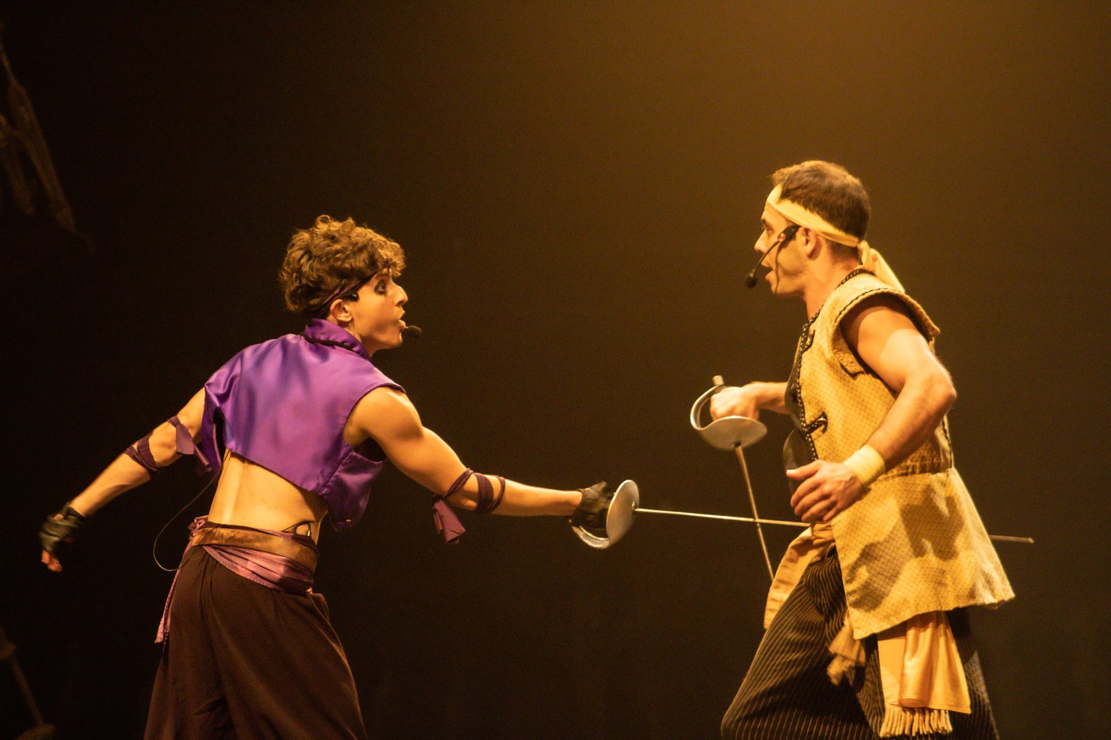 Two pirates cross swords in a live stage duel during the show