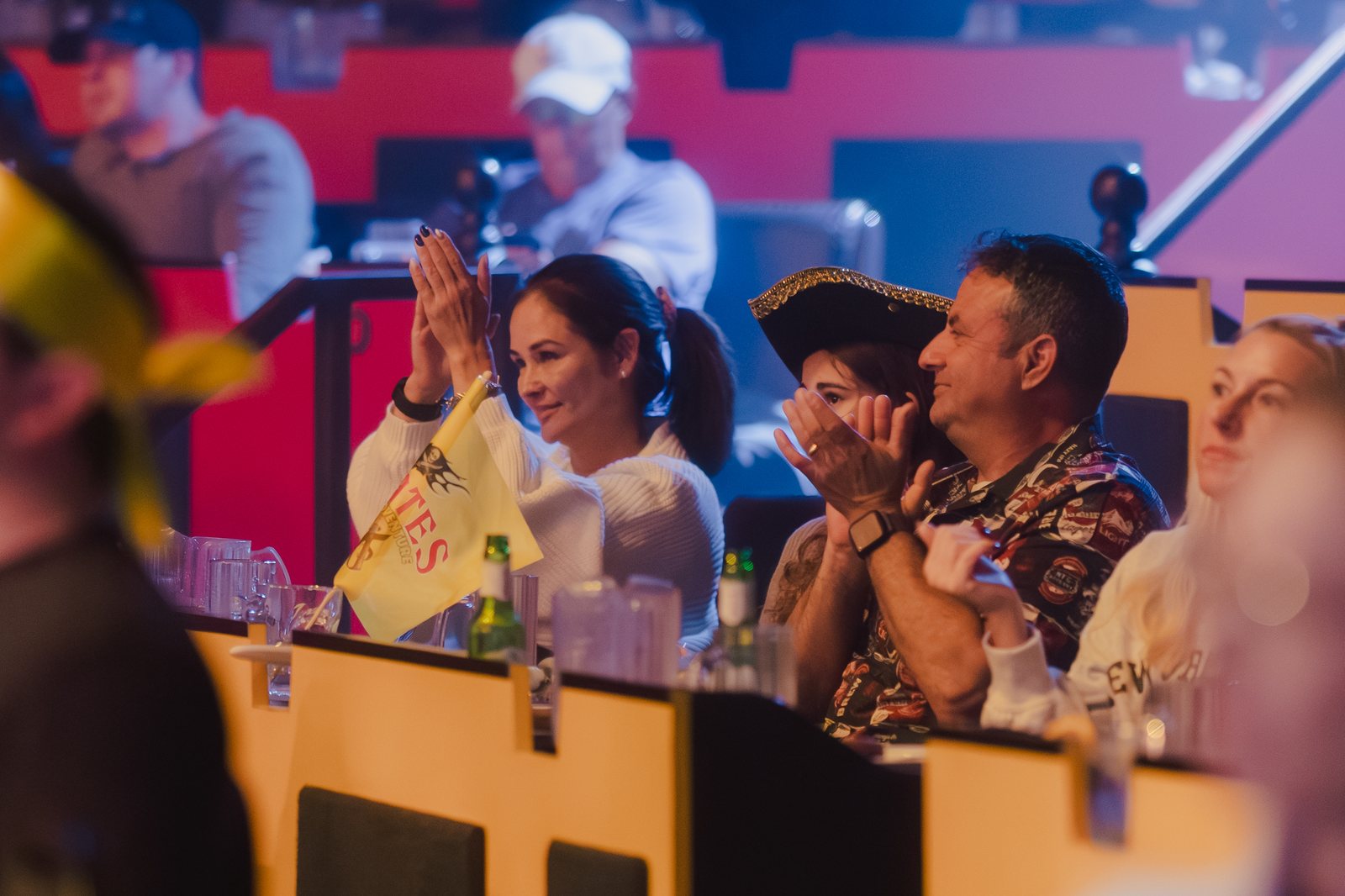 Guests cheer from their table as the action unfolds around them